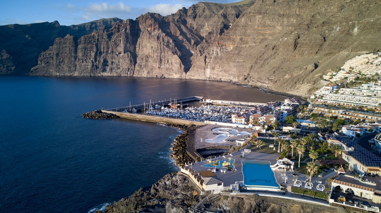 Los Gigantes cliffs rising behind the marina on Tenerife