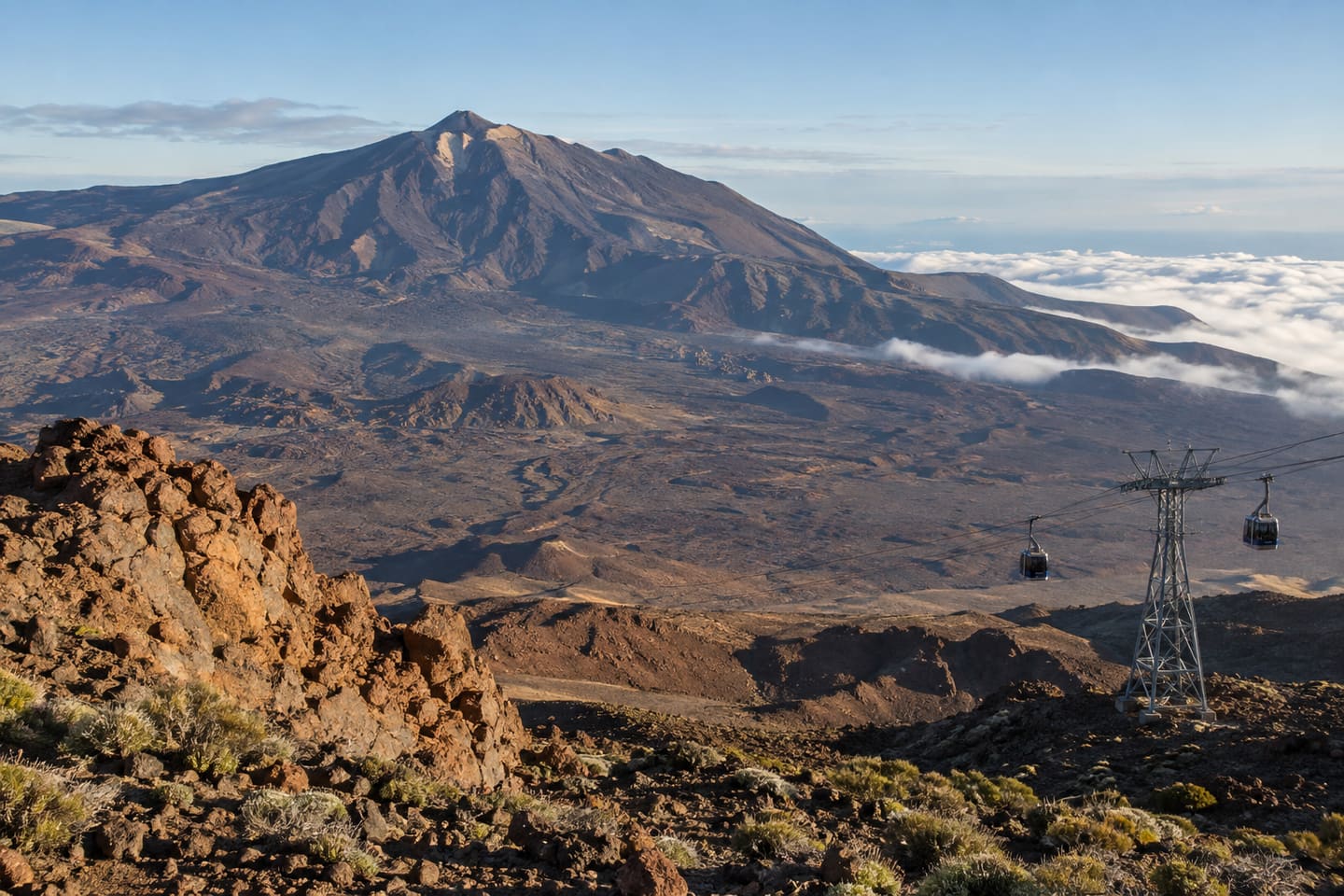 Mount Teide above the volcanic caldera with cable-car cabins in the foreground